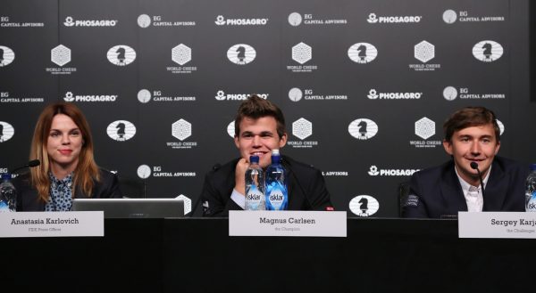 NEW YORK, NY - NOVEMBER 11:  (L-R) FIDE Press Officer Anastasia Karlovich, Reigning Chess Champion Magnus Carlsen and Chess grandmaster Sergey Karjakin speak at a press conference after a game during 2016 World Chess Championship at Fulton Market Building on November 11, 2016 in New York City.  (Photo by Rob Kim/Getty Images for Agon Limited )
